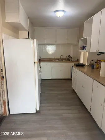 a kitchen with a refrigerator a sink and dishwasher