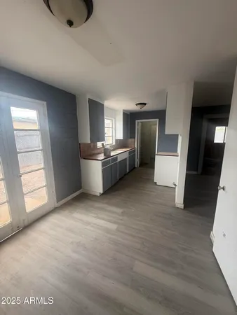 a room with a bed and furniture