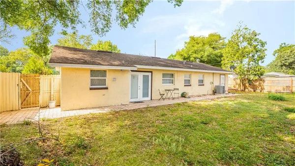 a house with trees in front of it