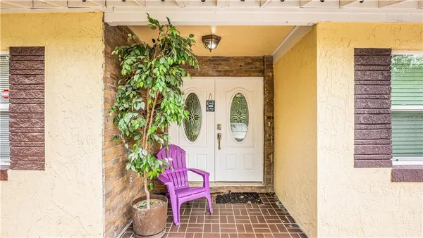 a front view of a house with seating space