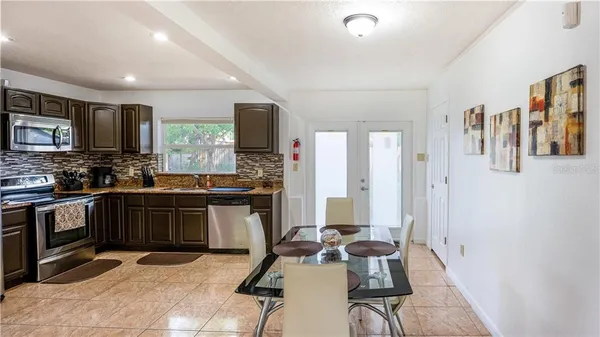 a kitchen with a sink appliances and cabinets