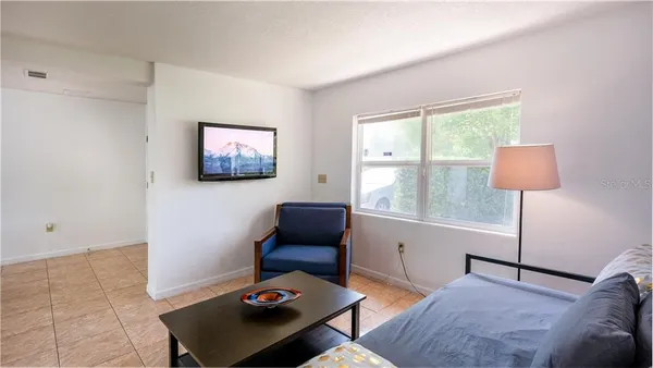 a living room with furniture and a window