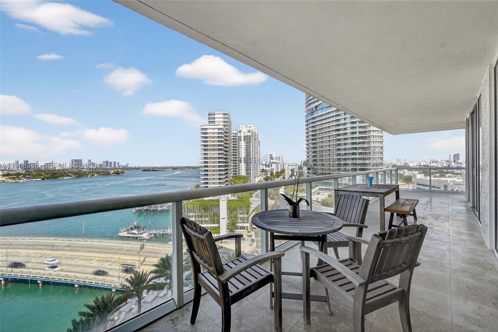 450 Alton Road, Unit 1202 Miami Beach, FL 33139 - Photo 13 of 15 a view of swimming pool with outdoor seating and city view