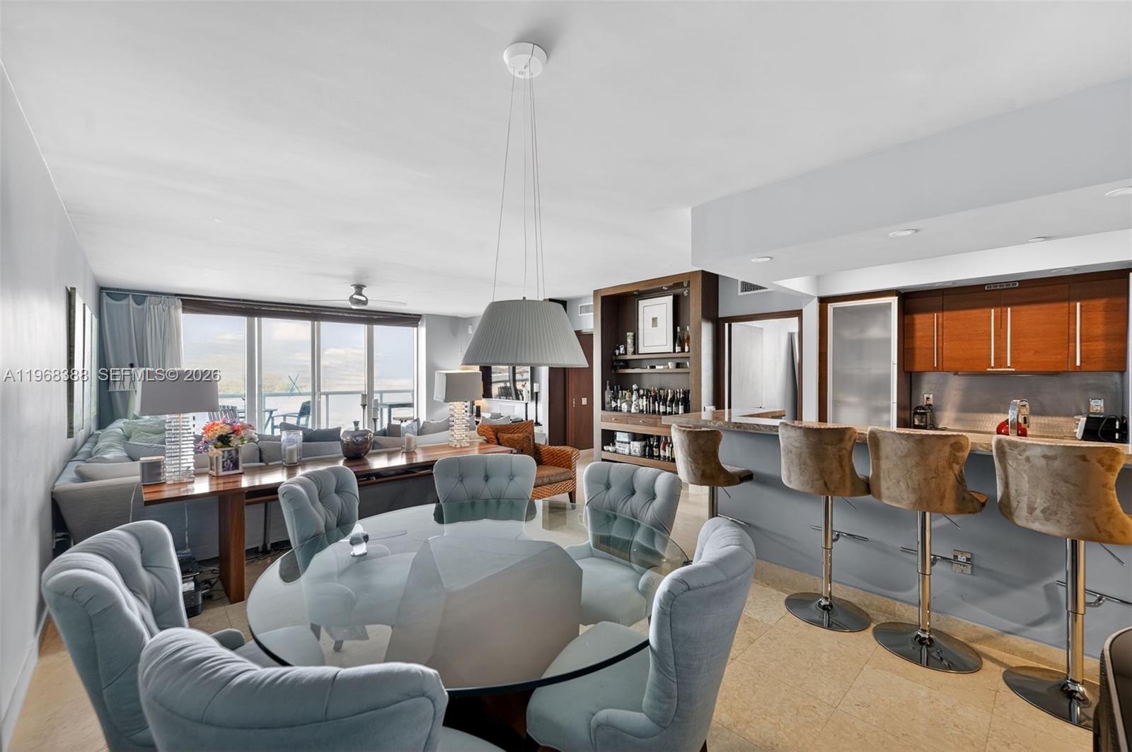 450 Alton Road, Unit 1202 Miami Beach, FL 33139 - Photo 3 of 15 a living room with furniture and a large window