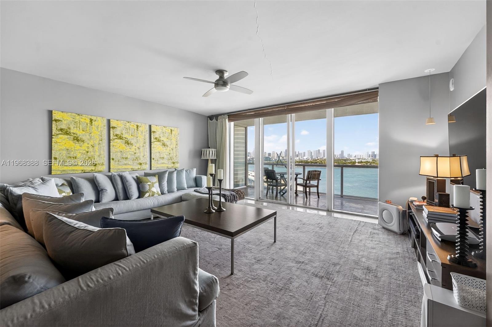450 Alton Road, Unit 1202 Miami Beach, FL 33139 - Photo 4 of 15 a living room with furniture and a large window
