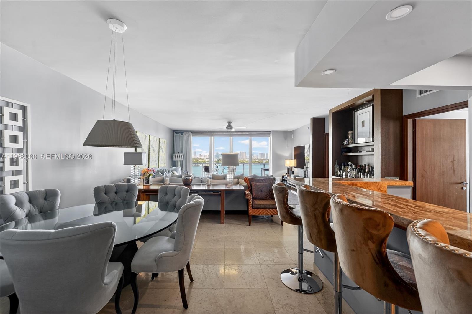 450 Alton Road, Unit 1202 Miami Beach, FL 33139 - Photo 5 of 15 a living room with furniture and a wooden floor