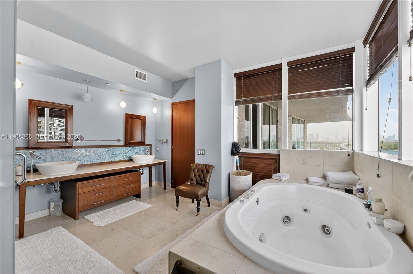 450 Alton Road, Unit 1202 Miami Beach, FL 33139 - Photo 9 of 15 a large white room with a large window and furniture