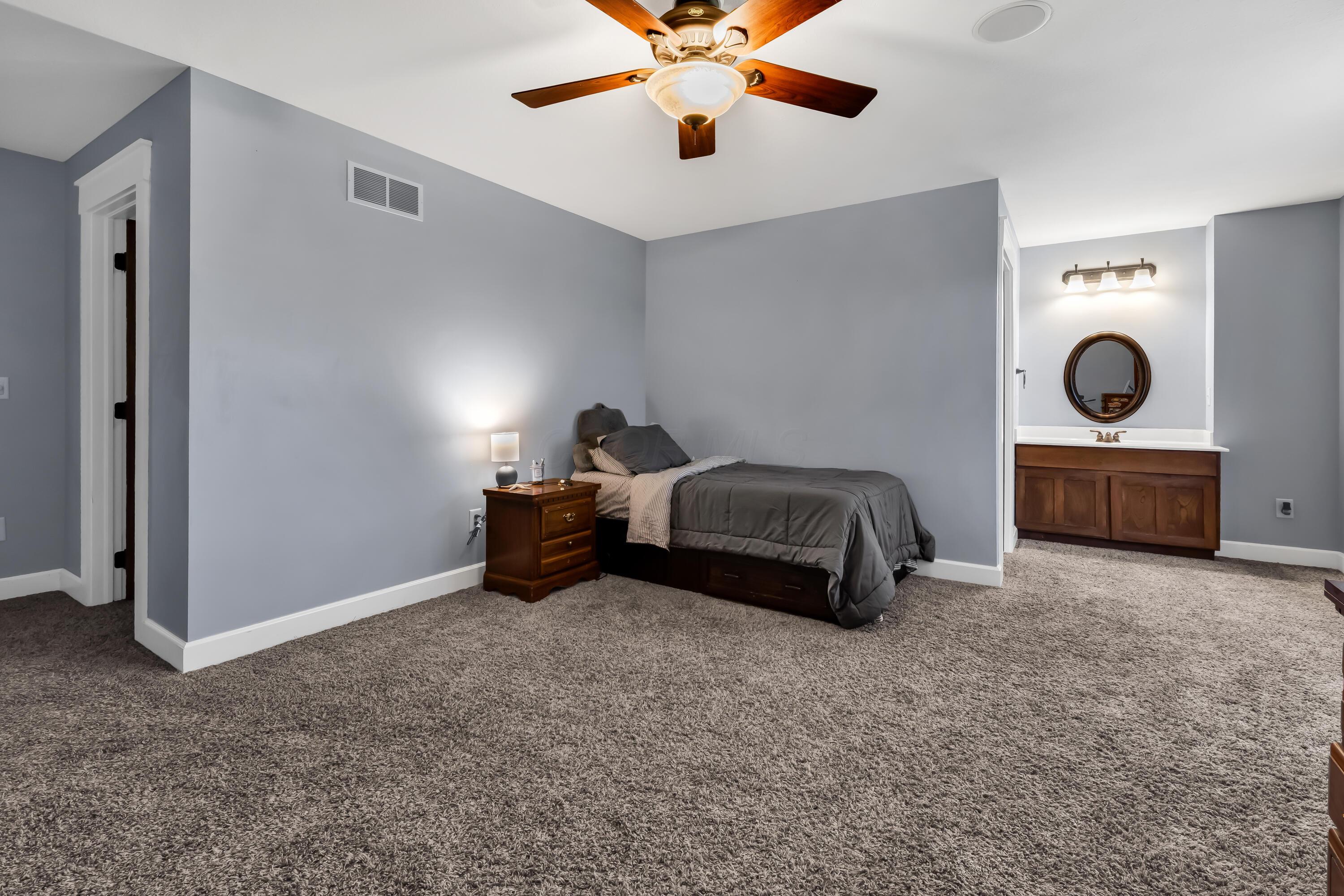 16689 Bailor Road Laurelville, OH 43135 - Photo 34 of 73 • Light sand carpet
• Grey painted walls
• Lighted ceiling fan