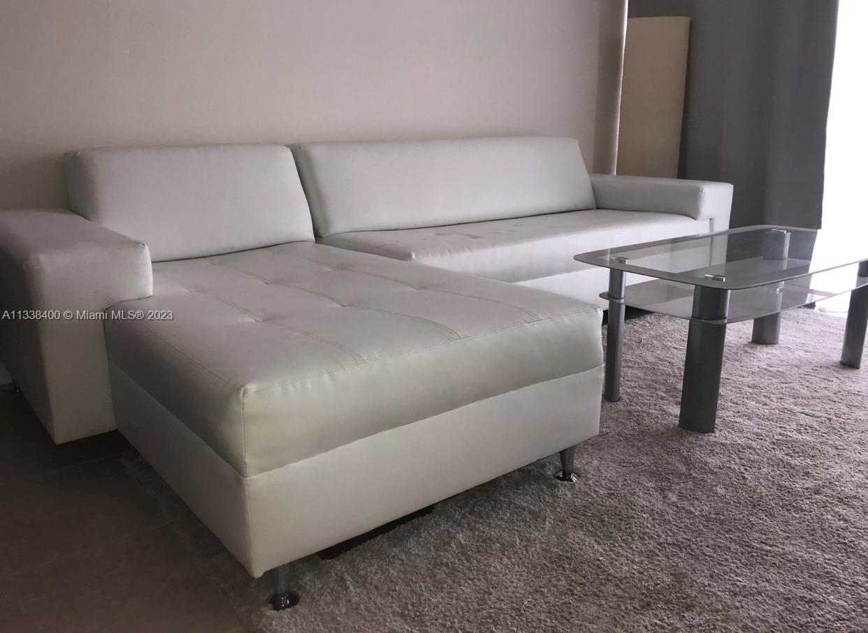 a living room with a couch and a table