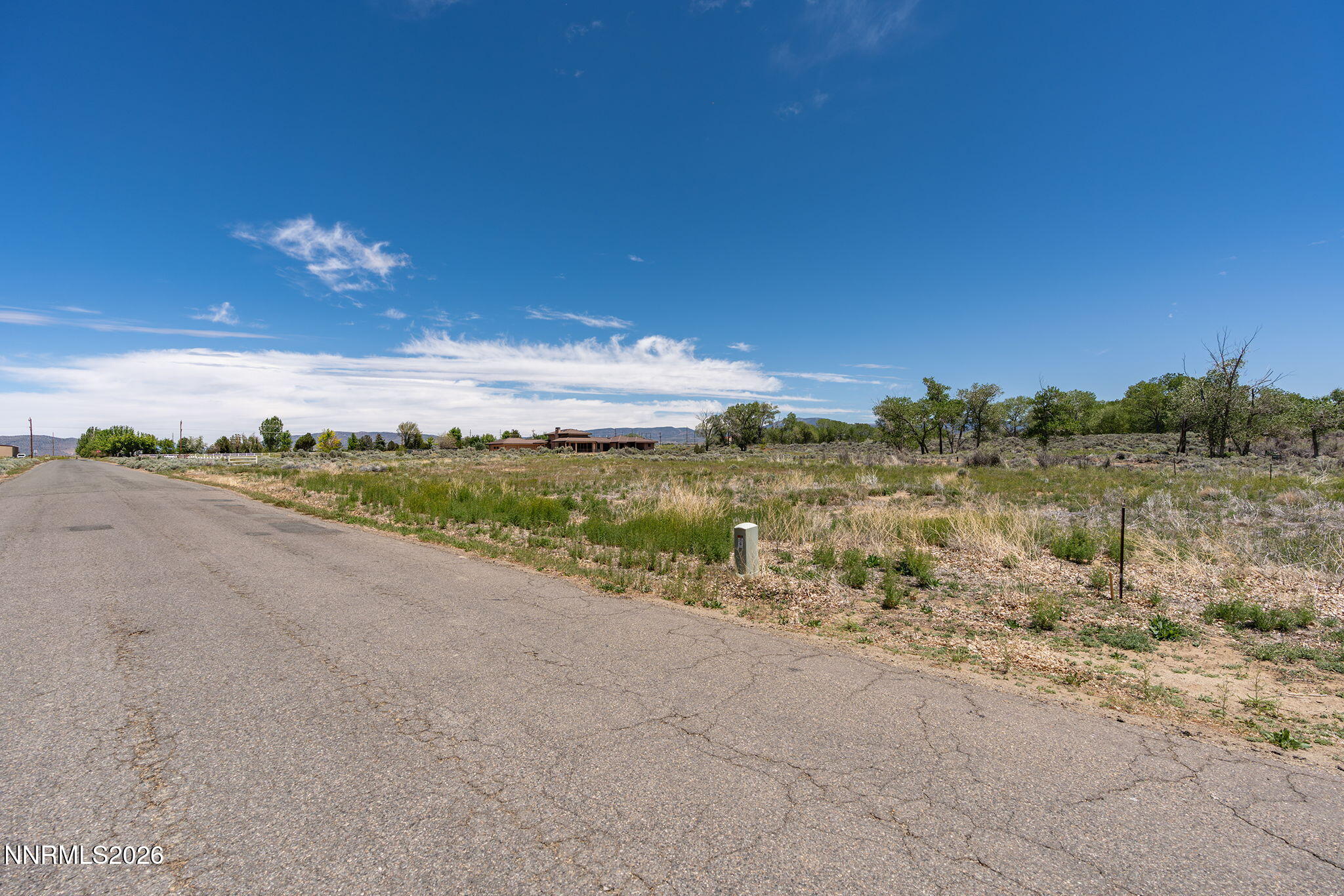 1655 Lombardy Road Gardnerville, NV 89410 - Photo 3 of 12 a view of a lake with houses in the back