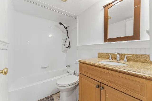 a bathroom with a sink a toilet and a bathtub