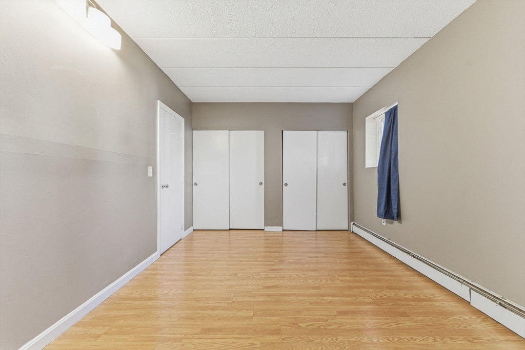 1011 Main Street, Unit 5 Woburn, MA 01801 - Photo 17 of 26 a view of an empty room