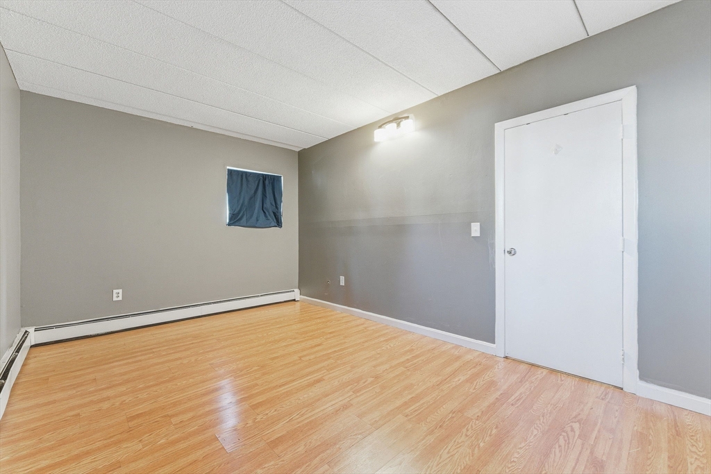 1011 Main Street, Unit 5 Woburn, MA 01801 - Photo 18 of 26 a view of an empty room