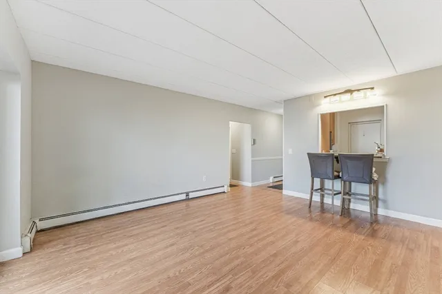 a view of a livingroom with furniture and wooden floor