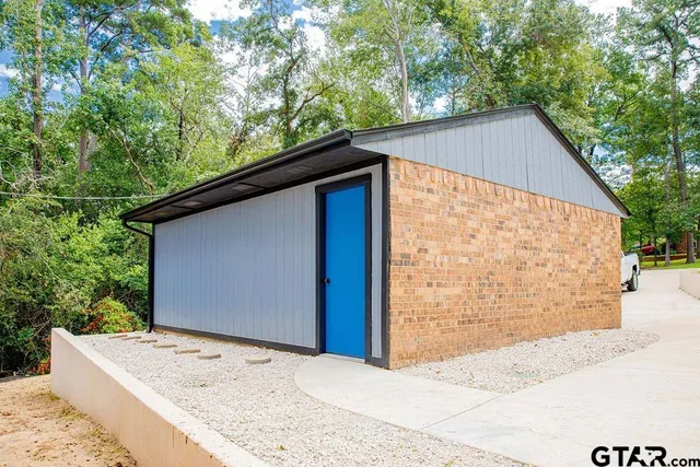 a backyard of a house with large trees