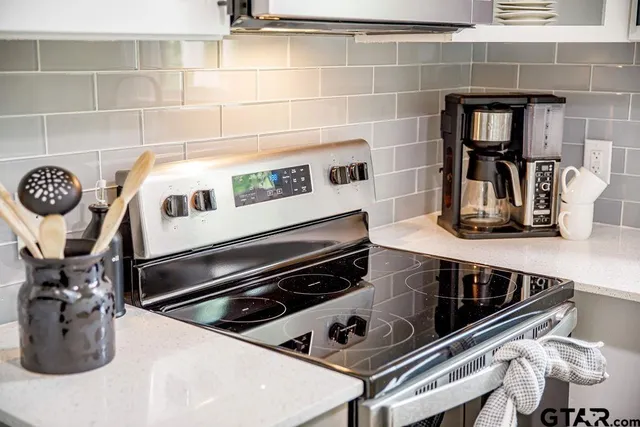 a kitchen with a stove and a microwave