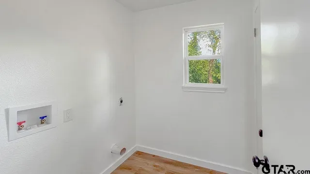 a view of a small space with window and closet