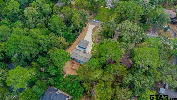 an aerial view of house with yard