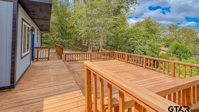 a view of a balcony with wooden floor