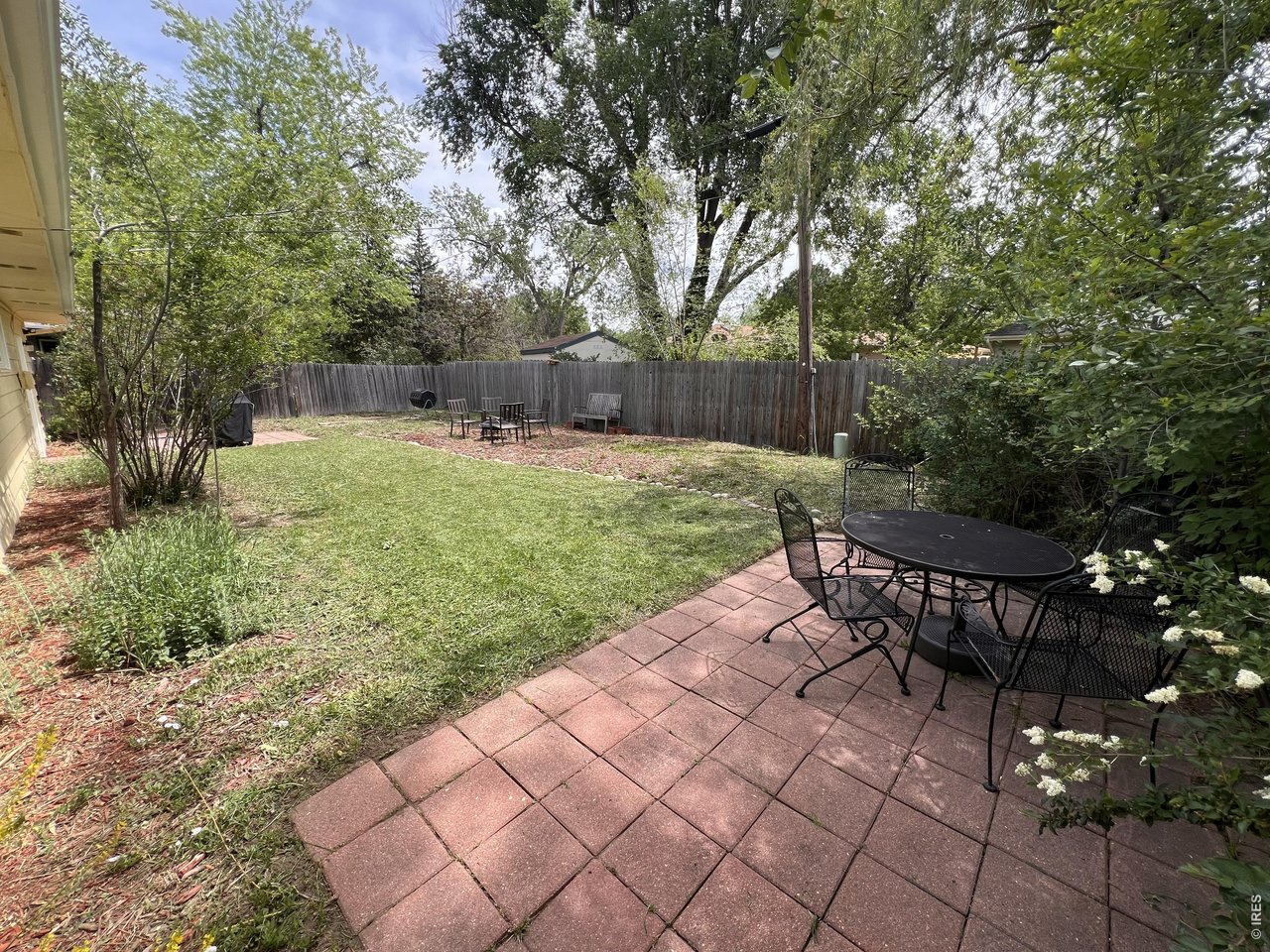 1709 Dale Court Fort Collins, CO 80521 - Photo 26 of 26 a view of a backyard with sitting area