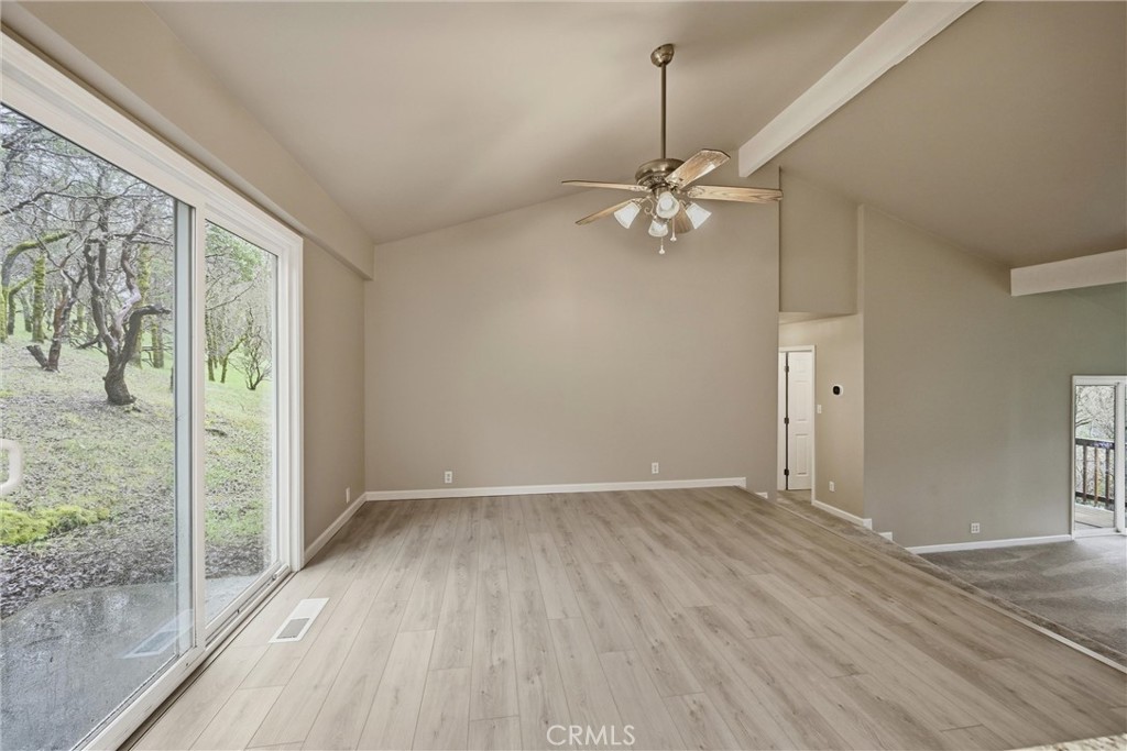 19474 Donkey Hill Road Hidden Valley Lake, CA 95467 - Photo 8 of 38 Large dining area sits above the living room and has sliding door to back patio.
