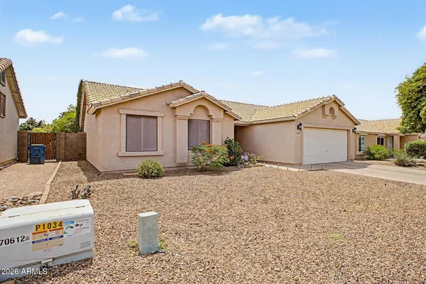 a view of a house with a sink and yard