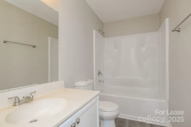 a bathroom with a sink a toilet and a bathtub