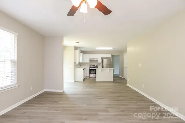 a view of a kitchen with a sink cabinets and window