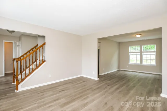a view of an entryway with wooden floor