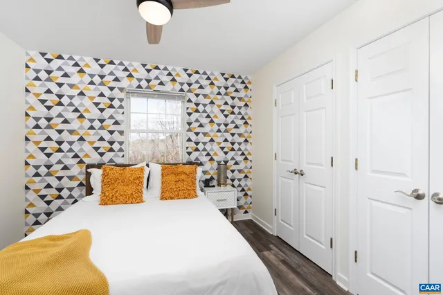 a bedroom with a bed and a couch