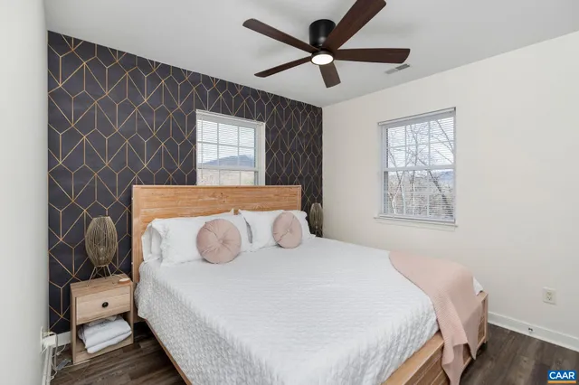 a bedroom with two beds and a window