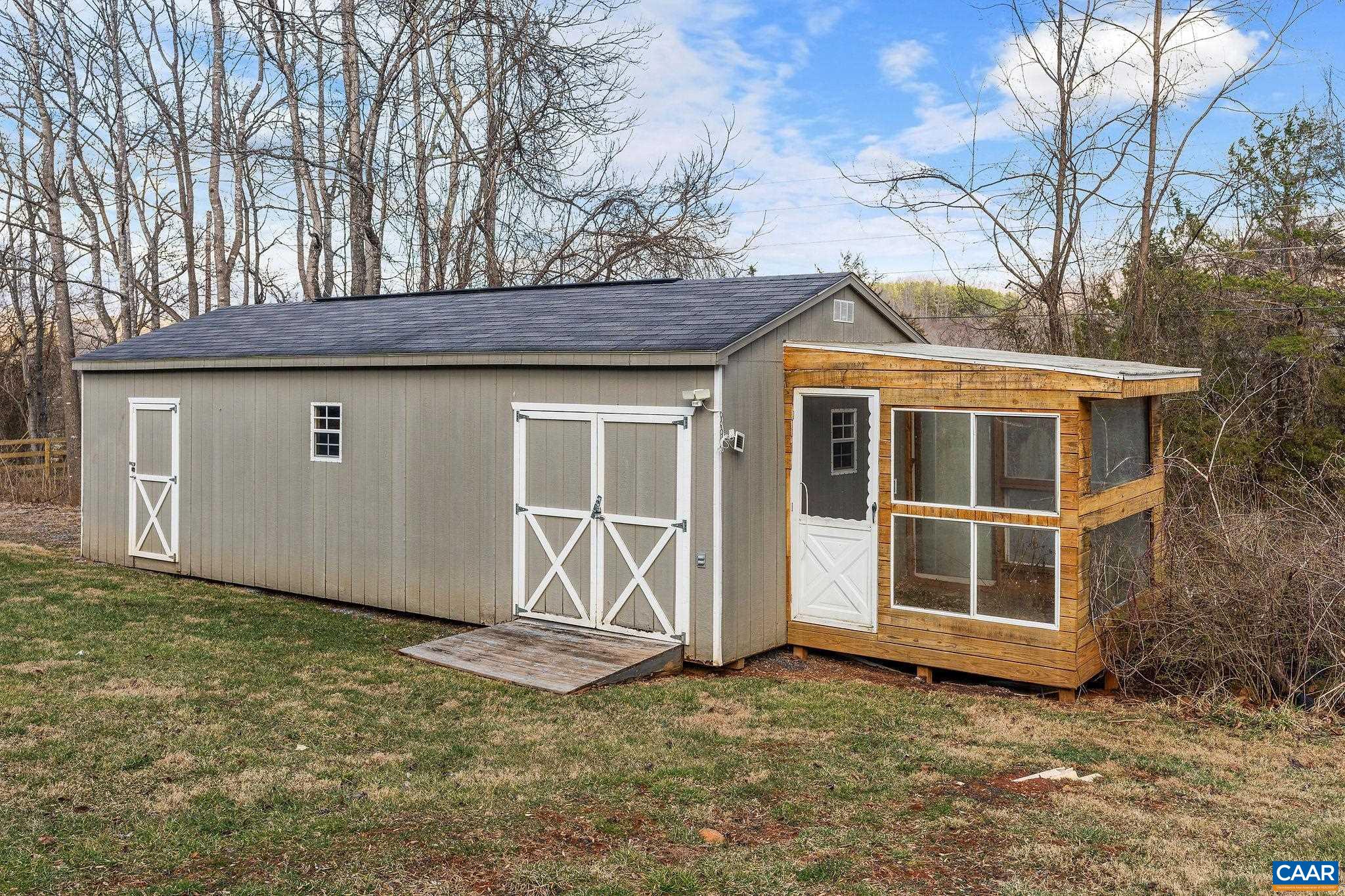 57 Pounding Branch Road Afton, VA 22920 - Photo 25 of 31 a view of a house with a large window and wooden fence
