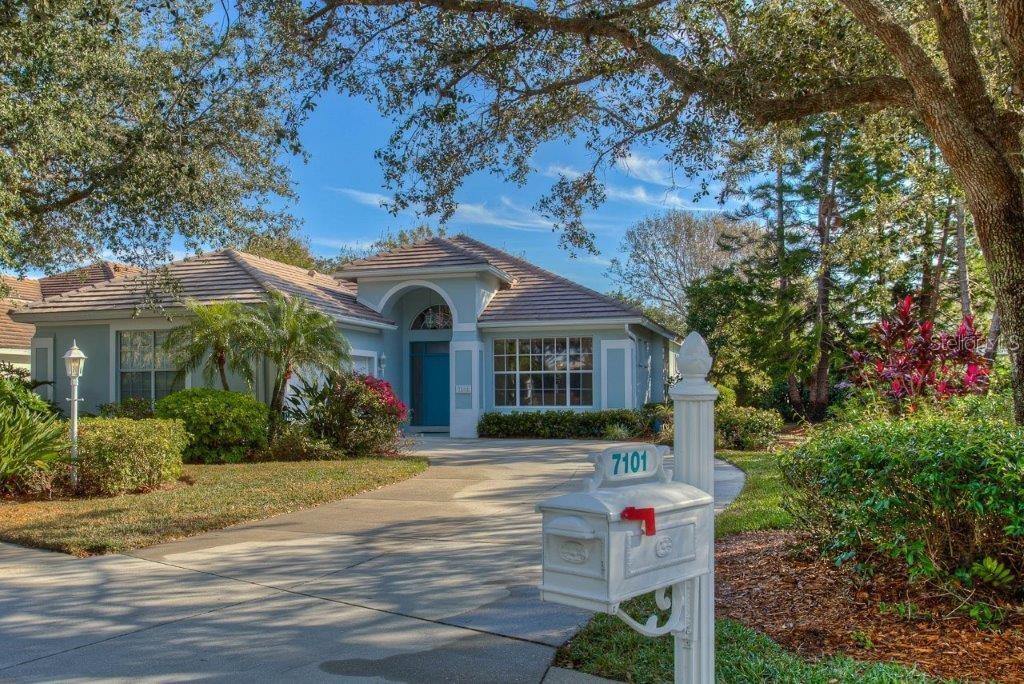 a front view of house with yard and green space