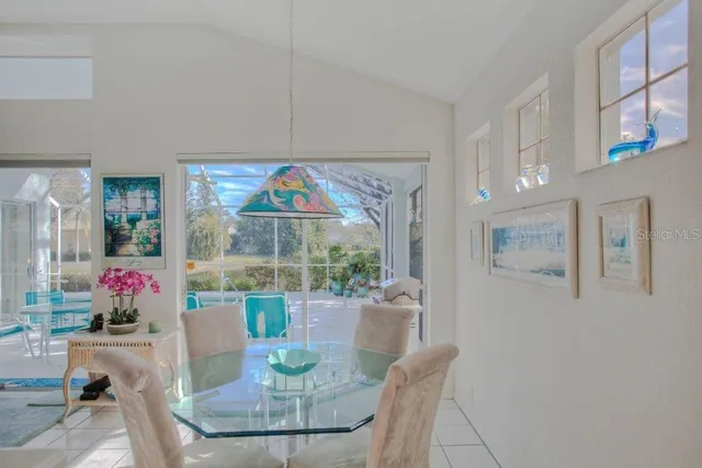 a dining room with furniture and window