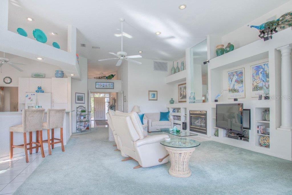 7101 Victoria Circle University Park, FL 34201 - Photo 14 of 31 a living room with furniture and a large window