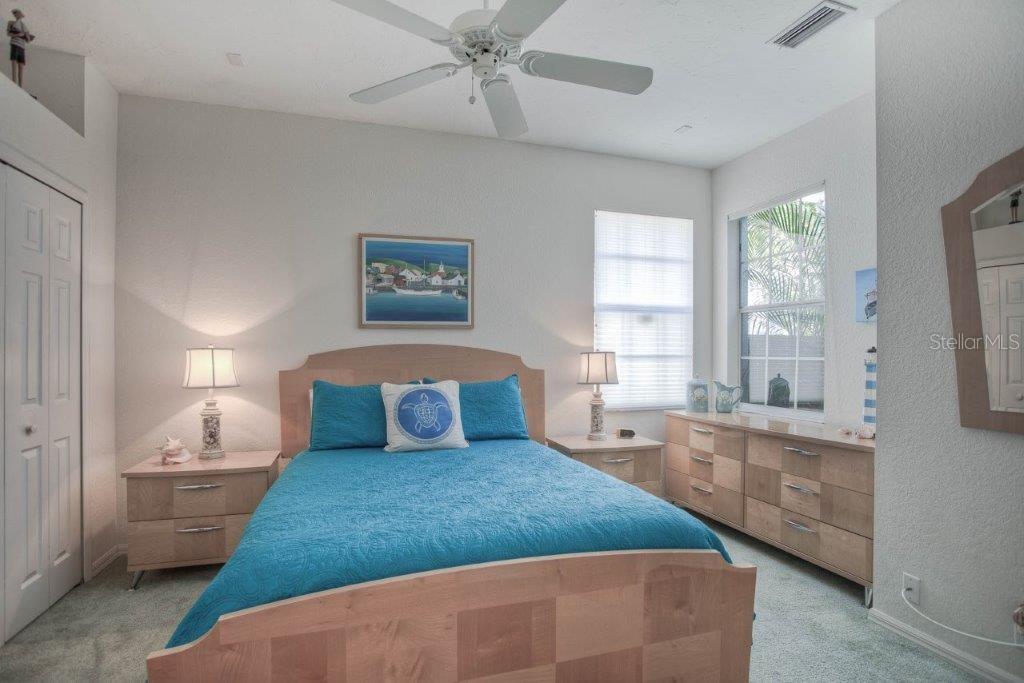 7101 Victoria Circle University Park, FL 34201 - Photo 16 of 31 a bedroom with a large bed and a window