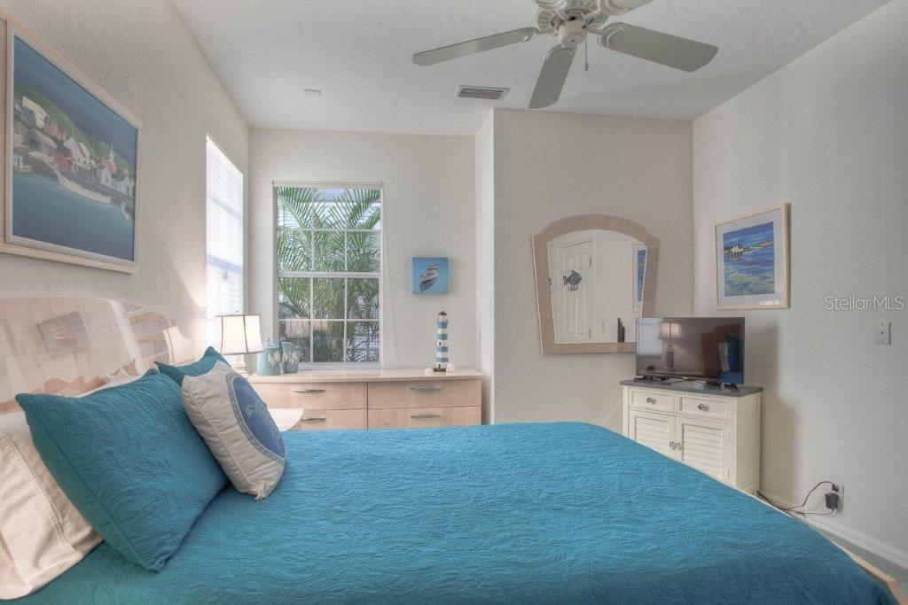 7101 Victoria Circle University Park, FL 34201 - Photo 17 of 31 a living room with a bed furniture and fireplace