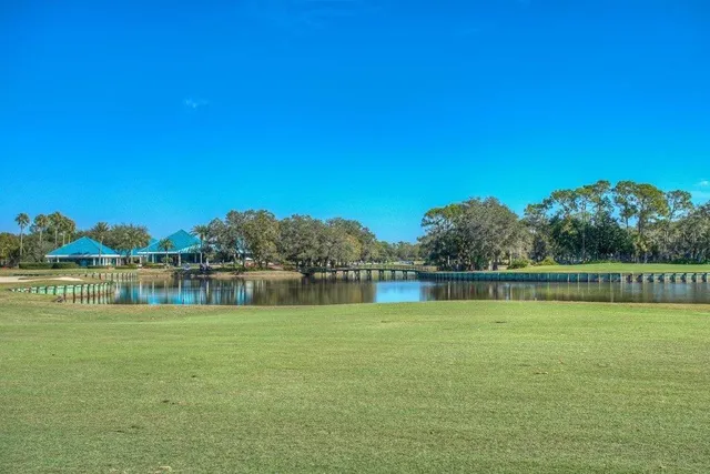 a view of a lake with houses in the back