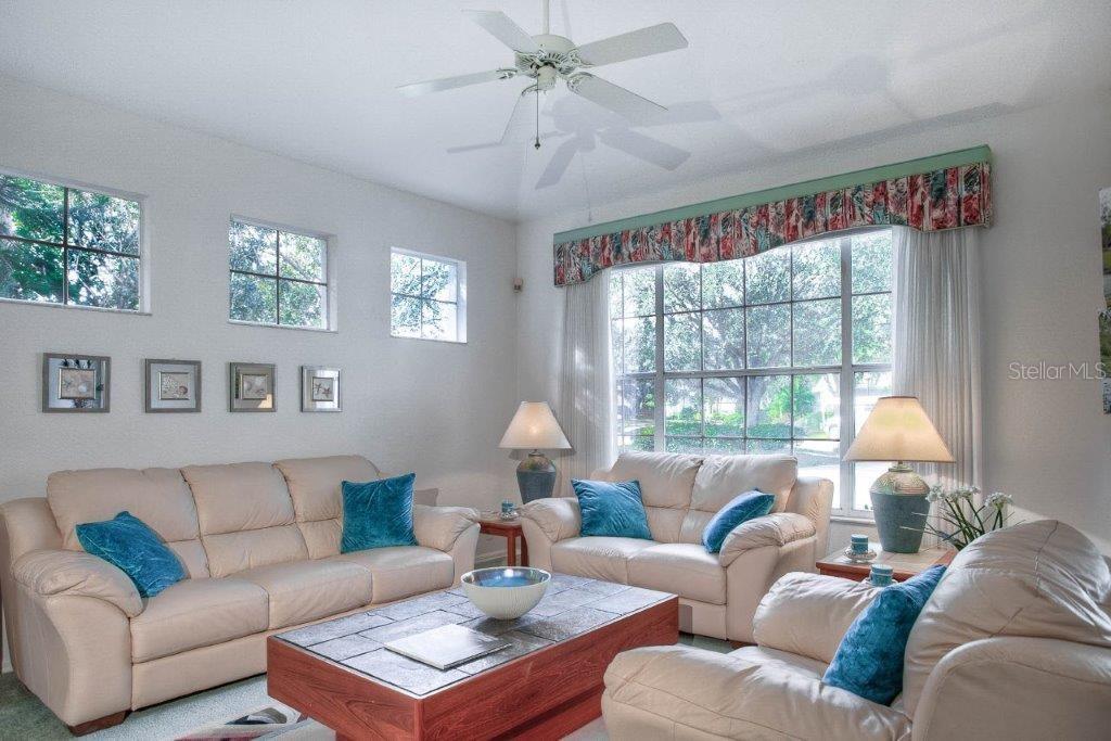 7101 Victoria Circle University Park, FL 34201 - Photo 8 of 31 a living room with furniture and a large window