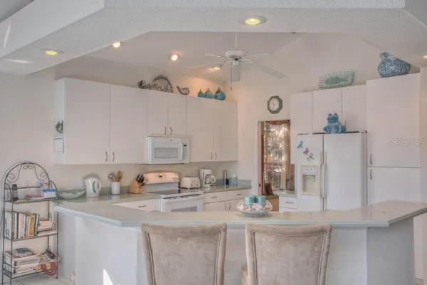 a kitchen with counter top space cabinets and stainless steel appliances