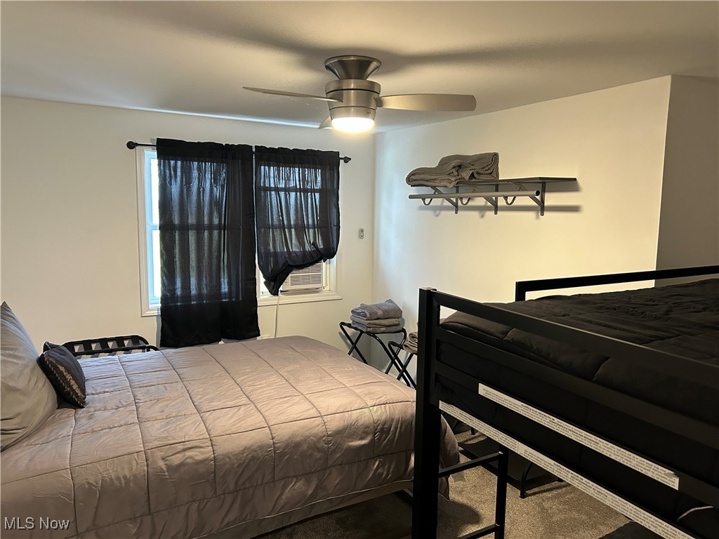 3005 Bardshar Road Sandusky, OH 44870 - Photo 15 of 24 Bedroom featuring carpet flooring and ceiling fan