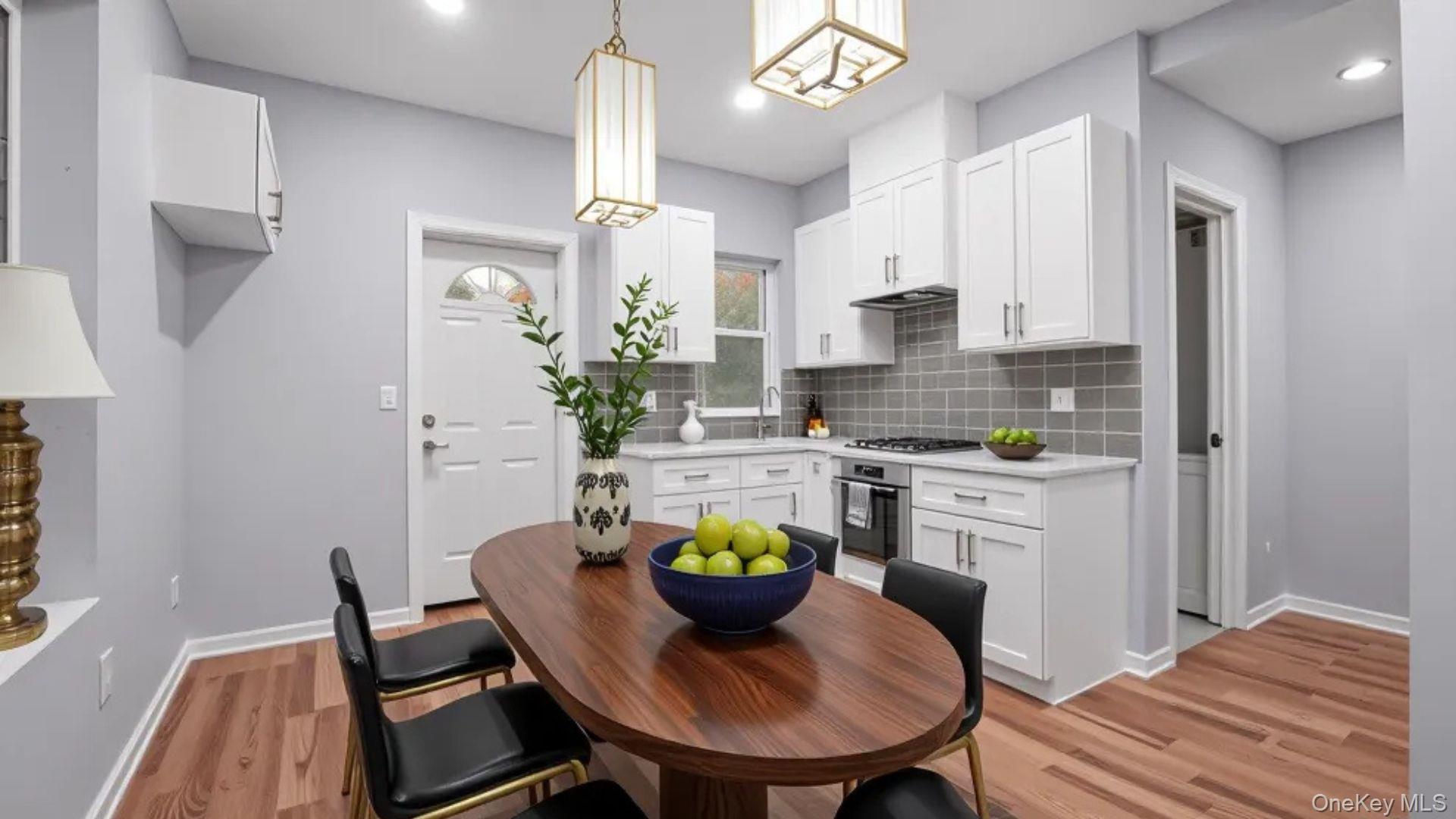 1513 Rosedale Avenue Bronx, NY 10460 - Photo 4 of 29 Kitchen featuring backsplash, white cabinets, light wood-style floors, stainless steel appliances, and recessed lighting