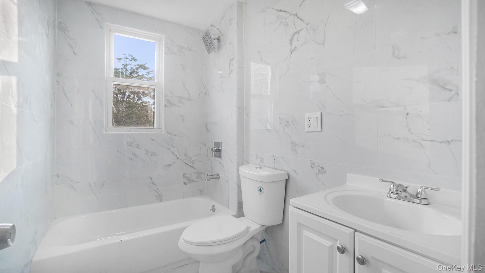 1513 Rosedale Avenue Bronx, NY 10460 - Photo 8 of 29 Bathroom with tile walls, vanity, and shower / washtub combination