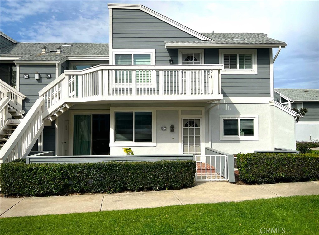 Lower single level corner condo facing a large grass area