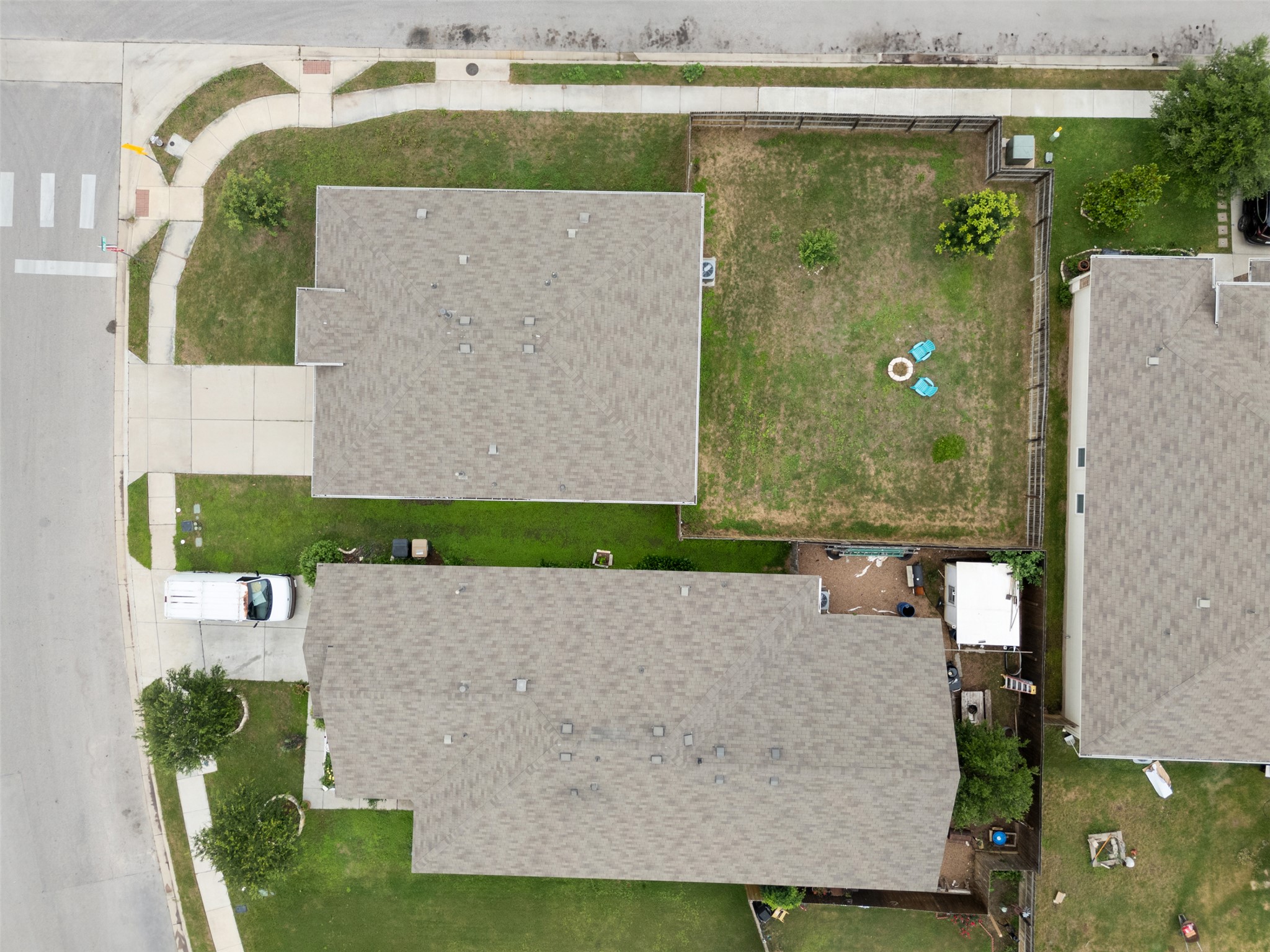 14900 Retha Pass Austin, TX 78725 - Photo 36 of 39 Property with an asphalt shingle roof, concrete driveway, and front lawn