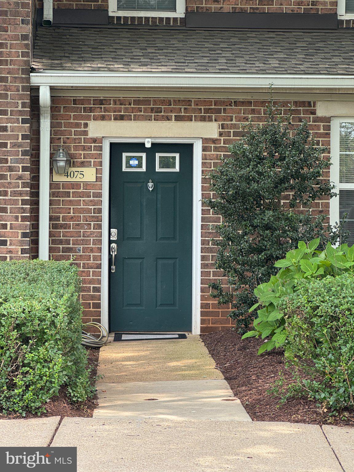 4075 Chesterwood Drive, Unit 4075 Silver Spring, MD 20906 - Photo 3 of 8 Charming entryway with lush greenery.