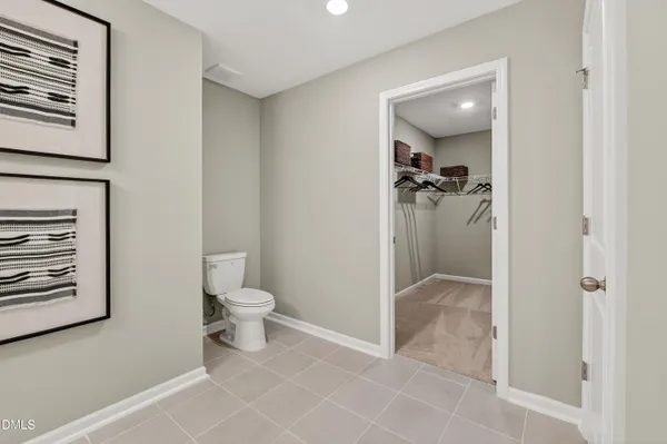 a bathroom with a bathtub shower sink vanity and mirror