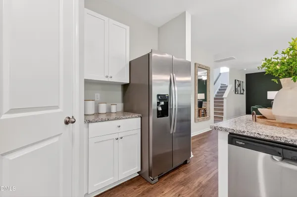 a kitchen with stainless steel appliances a refrigerator and a stove