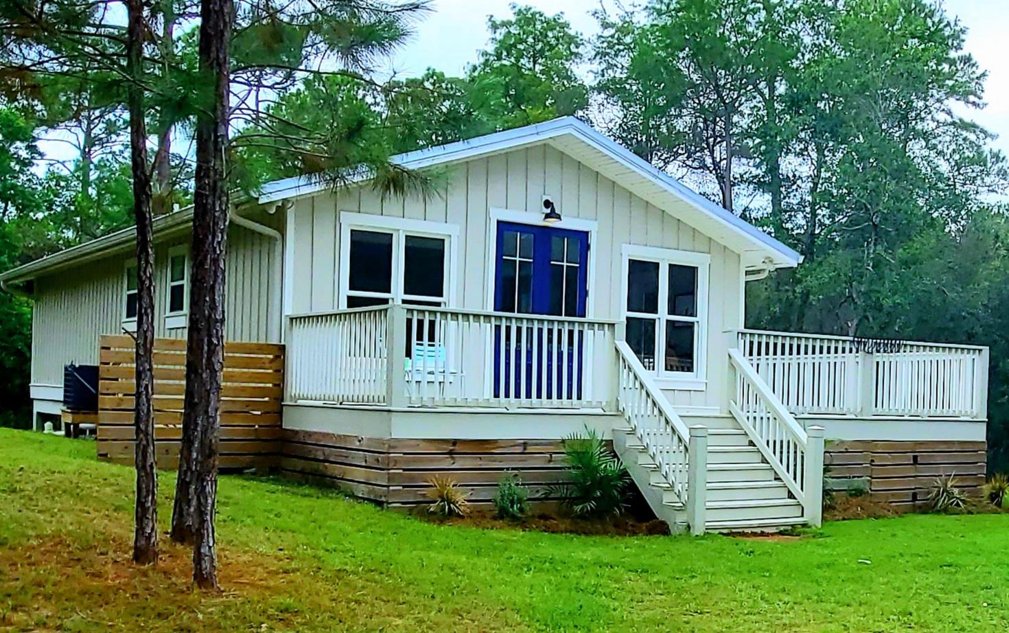 59 Chelsey Lane Santa Rosa Beach, FL 32459 - Photo 2 of 31 a front view of house with a garden