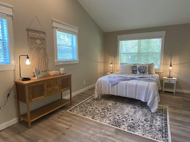 59 Chelsey Lane Santa Rosa Beach, FL 32459 - Photo 19 of 31 a bedroom with a bed and wooden floor